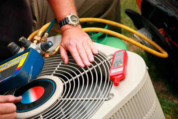 Technician testing an outdoor HVAC unit during service